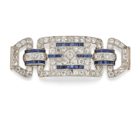 An Art Deco platinum, diamond and sapphire bracelet centre piece, of stylised belt buckle design, the central pavé diamond re
