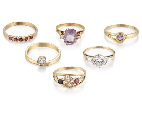 A group of six Continental rings, comprising: an Austrian amethyst and cubic zirconia three stone ring, ring size L¼; an Aust