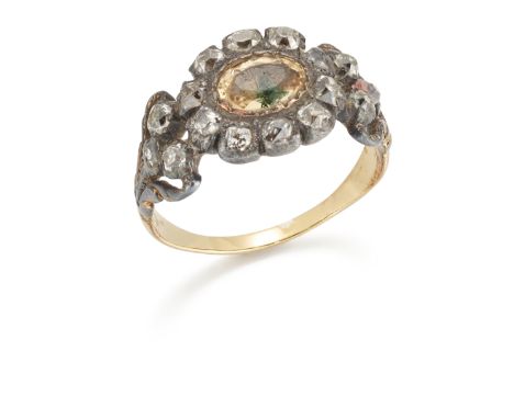 An early 19th century diamond and foiled topaz ring, the oval central topaz in old cut diamond surround, to openwork diamond-