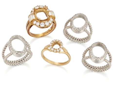 A group of five diamond set ring mounts, comprising: three of 18ct white gold with oval shaped bezels central stones deficien