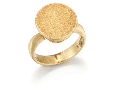 Cartier. A ring, the circular brushed finish head to polished gallery and hoop, signed Cartier, numbered 38573, circa 1980, r