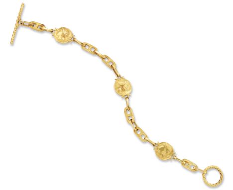 A 14ct gold bracelet, reproduction Greek coins, joined by trace and anchor-link chain, to toggle clasp, London import hallmar