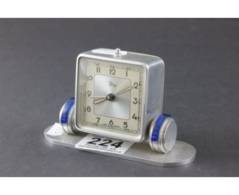 Art Deco French Chrome Cased Alarm Clock with Blue Plastic Shoulders, the square face marked Dep