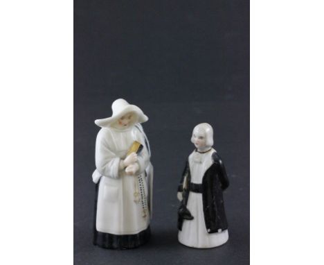 Two ceramic candle snuffers to include a Worcester nun