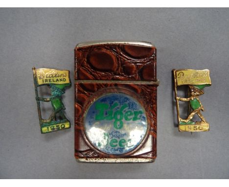 Two 1950 Enamelled ' Butlin's Ireland ' Badges featuring Leprechauns plus Vintage Revolt Lighter advertising Tiger Gold Medal