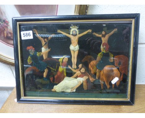 A vintage coloured print on glass titled THE CRUCIFIXION.