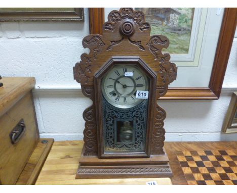 A vintage antique american ginger bread clock.with two train movement.