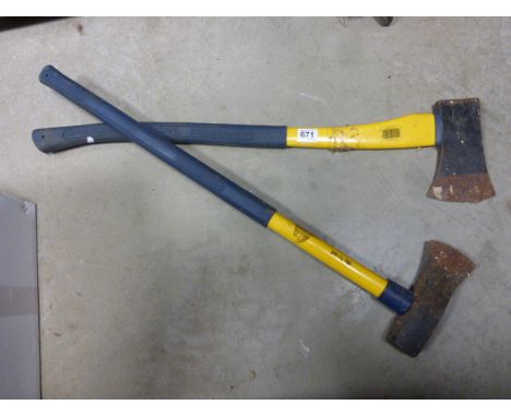A wood splitting axe and one other.