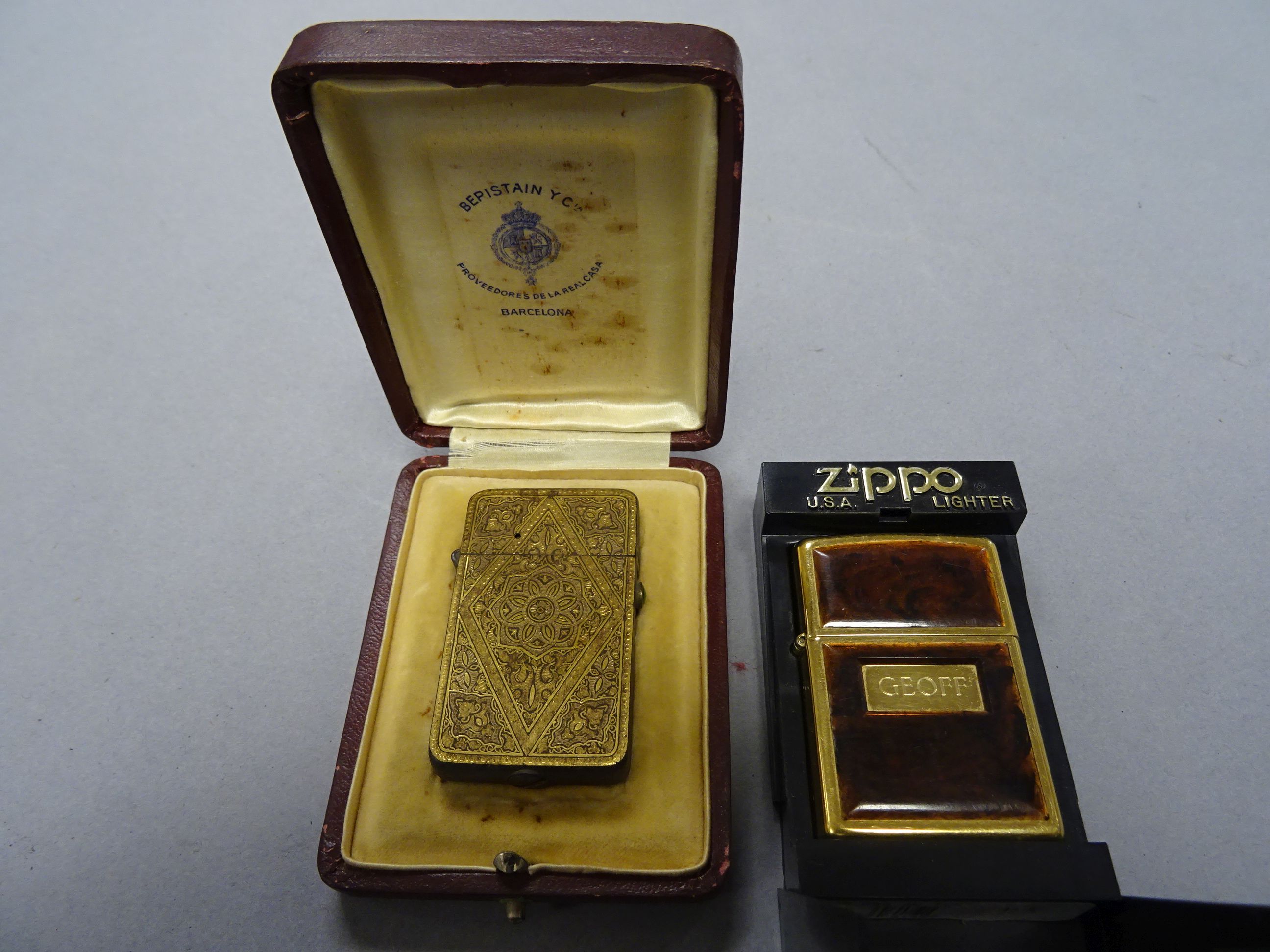 A cased Spanish lighter plus a cased Zippo lighter