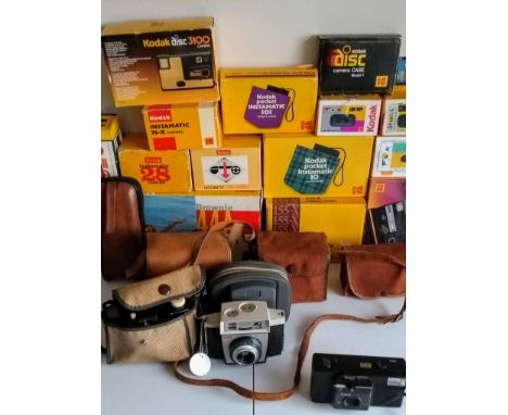 A selection of Kodak Brownie cameras in cases: 127 x 4, Cresta 3, Instamatic, Autosnap, Pocket, Funsaver, ColorSnap, etc. App