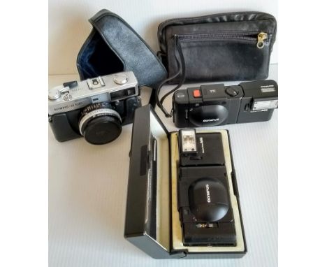 An Olympus XA3 compact camera with A16 flash and manual; an Olympus 35 SP camera with case, lens hood and manual and an Olymp