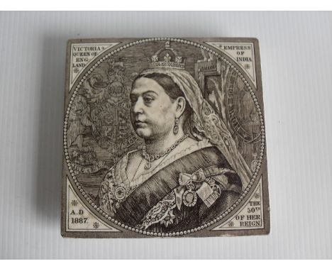 A Minton China Works brown printed commemorative tile teapot stand decorated with a head and shoulders bust portrait of Queen