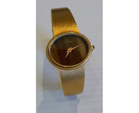 A ladies vintage Pierce 18ct yellow gold wrist watch with bracelet strap, 17 cm, oval dial, 25mm x 20mm, manual wind, gemston