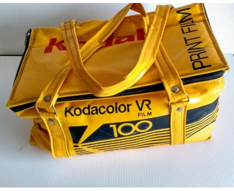 A yellow Kodak hold all containing: rangefinder with 2 ND filters in case; 4 Kodak filters; Kodak film pod case, Kodak retouc