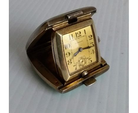 An Art Deco miniature silver-gilt and green enamel travel clock, Swiss hallmarks, Arabic numerals, not winding, 3.5 x 3.5cm 