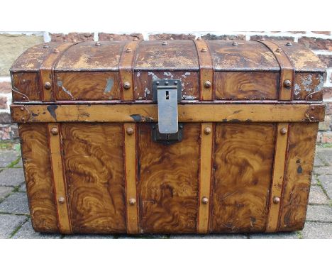 Large metal trunk with brass lock and wood grained decoration