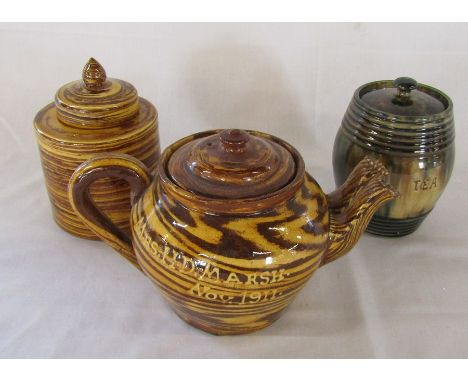 Slipware double spouted teapot marked 'Mrs H D Marsh Nov. 1911', slipware lidded jar 'C Hammon Feb 27 .12' to underside and e