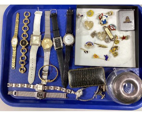 An Assortment of Enamelled Pin Badges, together with an engine turned vesta case, EPNS lidded dressing table tidy jar, an ass