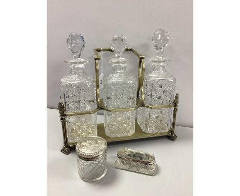 Two Hallmarked Silver Lidded Glass Dressing Table Trinket Box / Jars, together with a three bottle plated decanter stand, fit