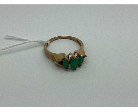 A 9ct Gold Three Stone Dress Ring, the marquise shaped stones of graduated size, to Modernist style diamond set shoulders and