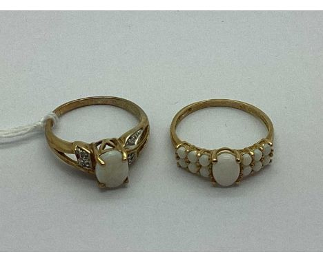 A 9ct Gold Opal Set Dress Ring, the oval centre stone to four claw setting, between diamond set bifurcated shoulders (finger 