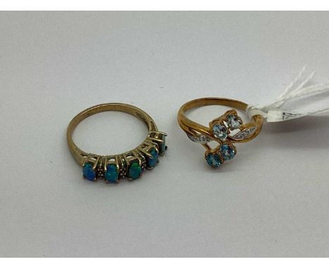 A 9ct Gold Stone Set Dress Ring, of foliage inspired design, to diamond set bifurcated shoulders (finger size N); A Five Ston