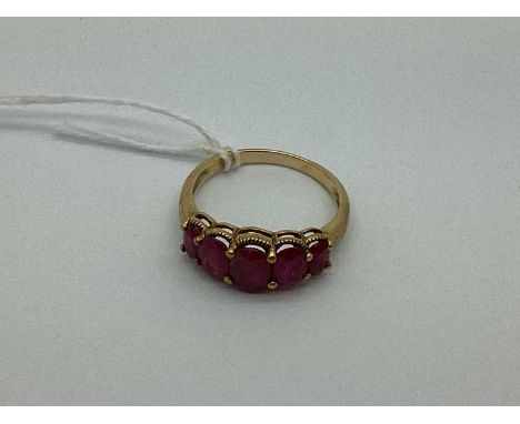 A 9ct Gold Five Stone Dress Ring, the graduated oval shape stones of faceted cut, to beaded framing and tapered band (finger 