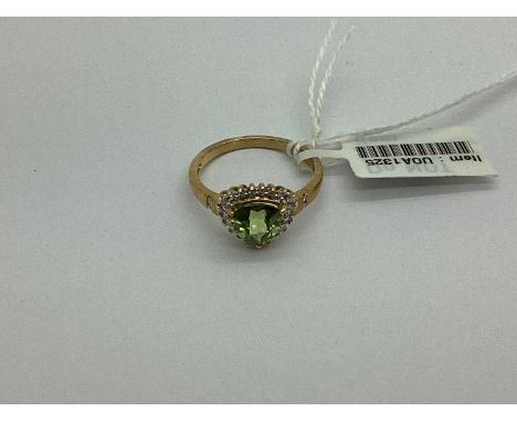 A 9ct Gold Stone Set Cluster Ring, the kite shaped stone set to centre, within diamond set border, to diamond set tapered ban