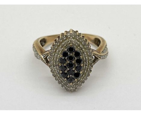 A Diamond and Sapphire Set Dress Ring, of marquise shape cluster design, claw set throughout, to diamond set crossover bifurc