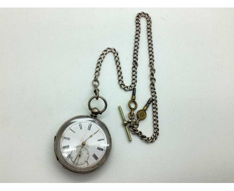 An Openface Pocket Watch, the white enamel dial with black Roman numerals and seconds subsidiary dial, within engine turned (