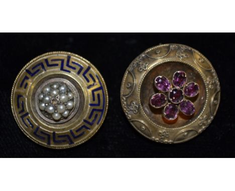 A Victorian gold framed mourning brooch, set with a central seven stone amethyst flower, dished frame, wirework border, glaze