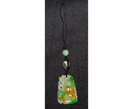 A Chinese carved jade pendant, tapering principle panel floral sided bamboo brush pot, double beaded cord suspension, 15.4cm 