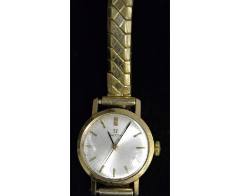 Omega - a lady's 9ct gold wrist watch, silvered dial, baton markers, minute track, centre seconds, manual 630 cal movement, s