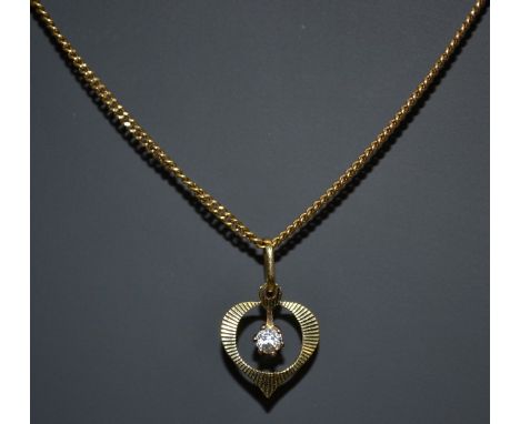 A diamond heart pendant necklace, central round brilliant cut diamond, approx 0.07ct, surrounded by an engine turned 14ct gol