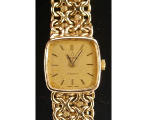 Omega - a lady's 9ct gold cased 1061 bracelet watch, textured gold coloured cushion dial, baton markers, manual movement, Cal