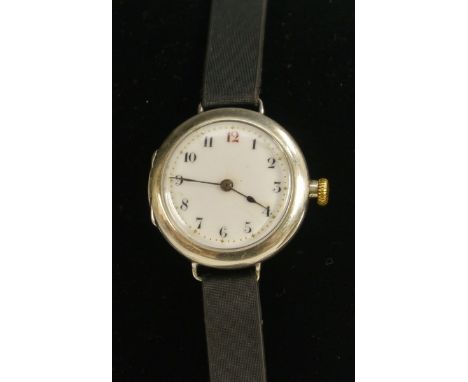 Rolex - a silver trench wristlet watch, white enamel dial, Arabic numerals, minute track, manual wind movement, signed Rolex 