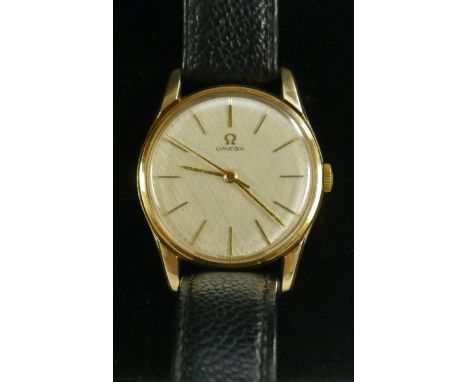 Omega - a vintage 1960s 9ct gold cased wristwatch, brushed silvered dial, baton markers,minute track, centre seconds, manual 