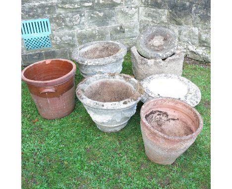 A collection of garden stoneware, to include a pair of urns,&nbsp; bow front trough, a terracotta pot etc