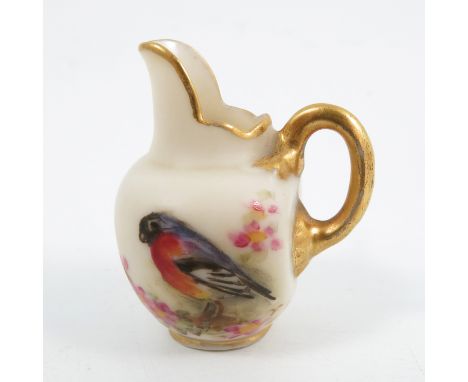 A Royal Worcester miniature flat back jug, decorated with a bull finch and apple blossom, height 1.5insCondition Report:  Ins