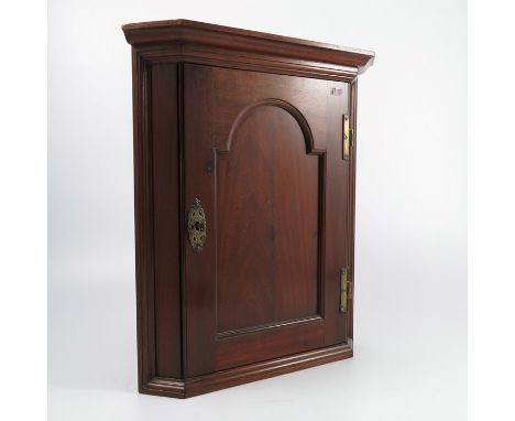 A small mahogany corner cupboard, with arched panel door, opening to reveal a shelf, height 17ins