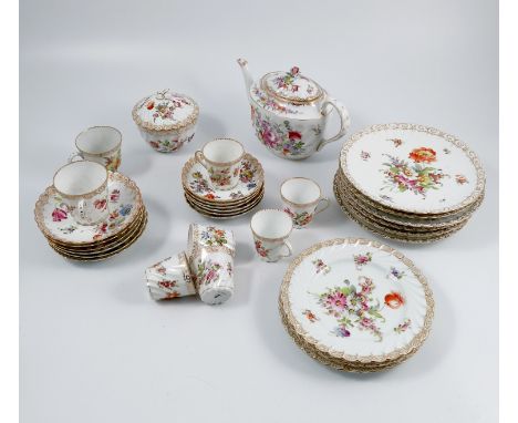 A Dresden china part service, comprising a tea pot, a jug, a comport, two footed bowls, six plates, six side plates, six tea 