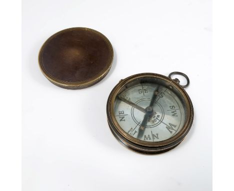 A circular metal cased compass, with engraved silvered dial, marked Made in France, diameter 2.25ins