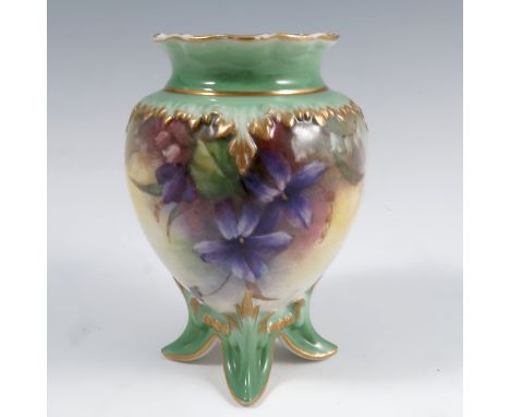 A Hadley's Worcester vase, decorated with violets to a green ground, raised on four splayed feet, height 3.5insCondition Repo