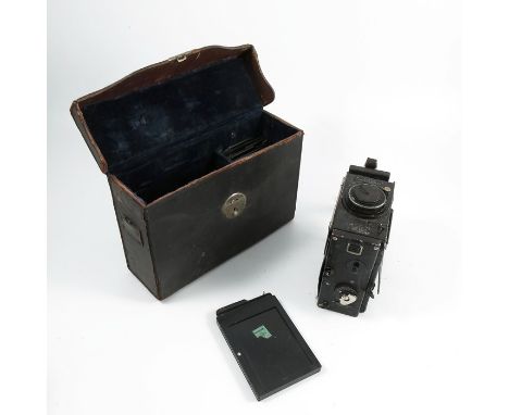 A cased Ensign Folding Reflex camera, by the Houghton-Butcher MFG.CO.LTD., with Ross London lens together with four plates