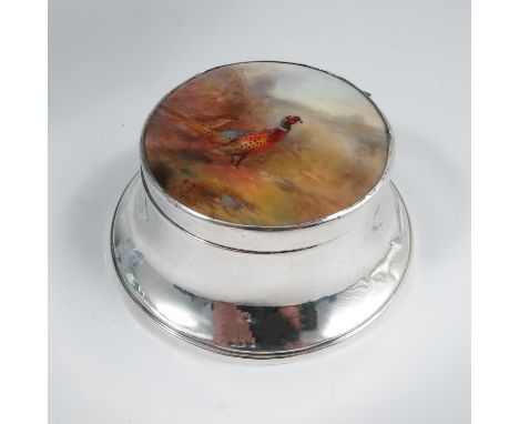 A hallmarked silver capstan shaped compact, with a circular panel, probably Royal Worcester, decorated with a cock and hen ph
