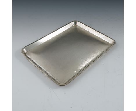 A rectangular silver dressing table tray, with engine turning and engraved with initials and date, Birmingham 1926, weight 9o