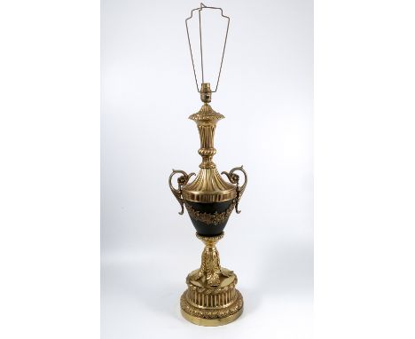 A gilt metal table lamp, of urn shaped support, raised on a reeded turned pedestal, height 24.5ins