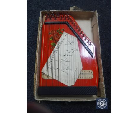 A boxed Jobel tone table top harp 