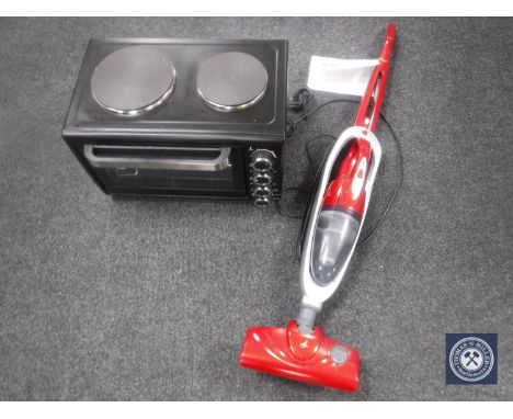 A table oven and a Lakeland 2 in 1 stick vac 