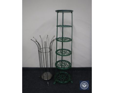 A cast metal five tier plant stand and a metal stick stand 